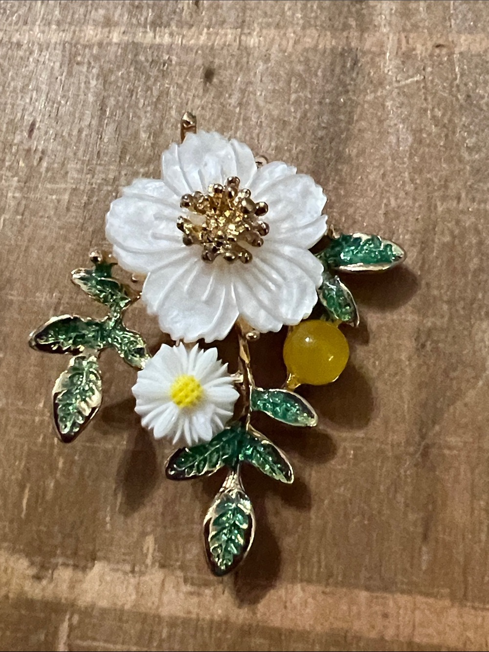 3/$18 White Flower and Green Leaf Brooch with Yellow Accent - Lot 415